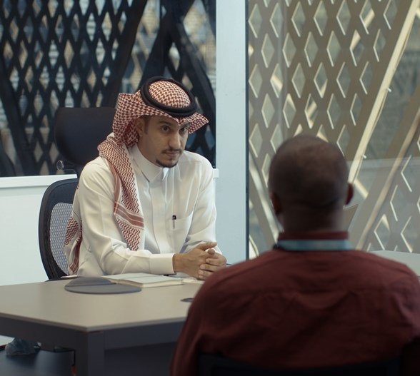 Two men discussing a new project at Red Sea International Company.